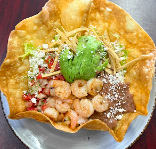 Karavela's Mexican and Peruvian Food signature dishes Shrimp Tacos
Chilaquiles
Deshebrada